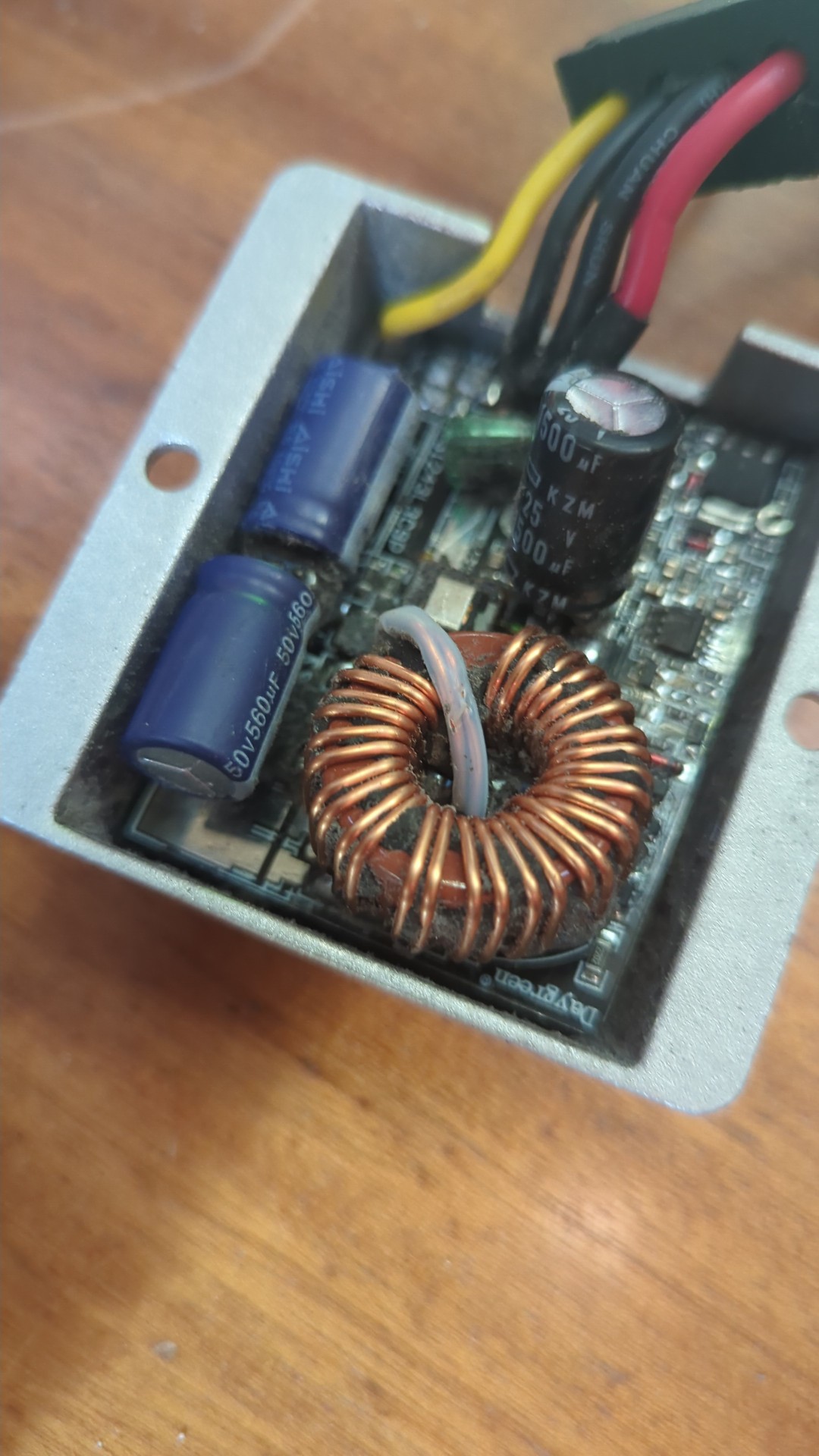 Power supply with all its potting removed.