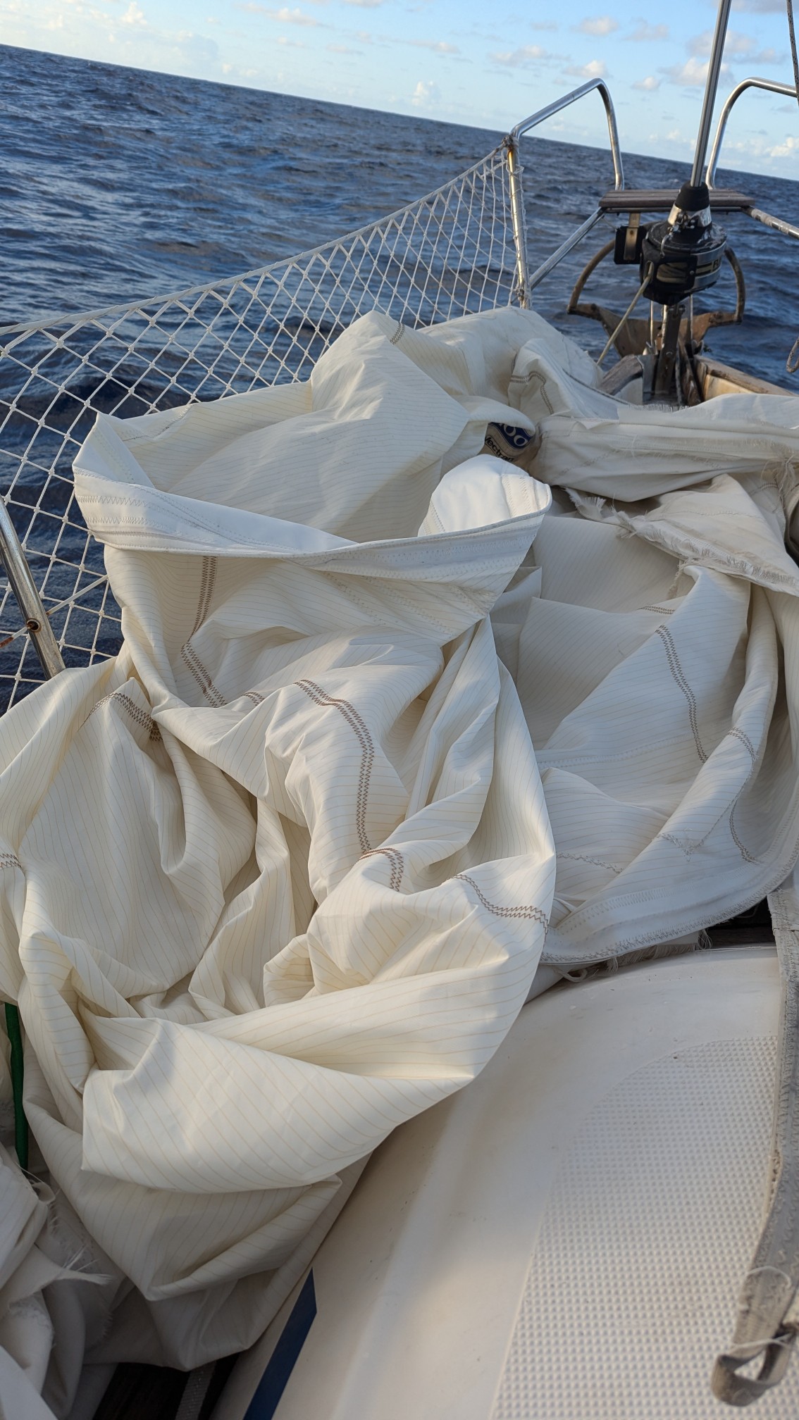 Our forsail, in a heap on the deck, with a broken head.